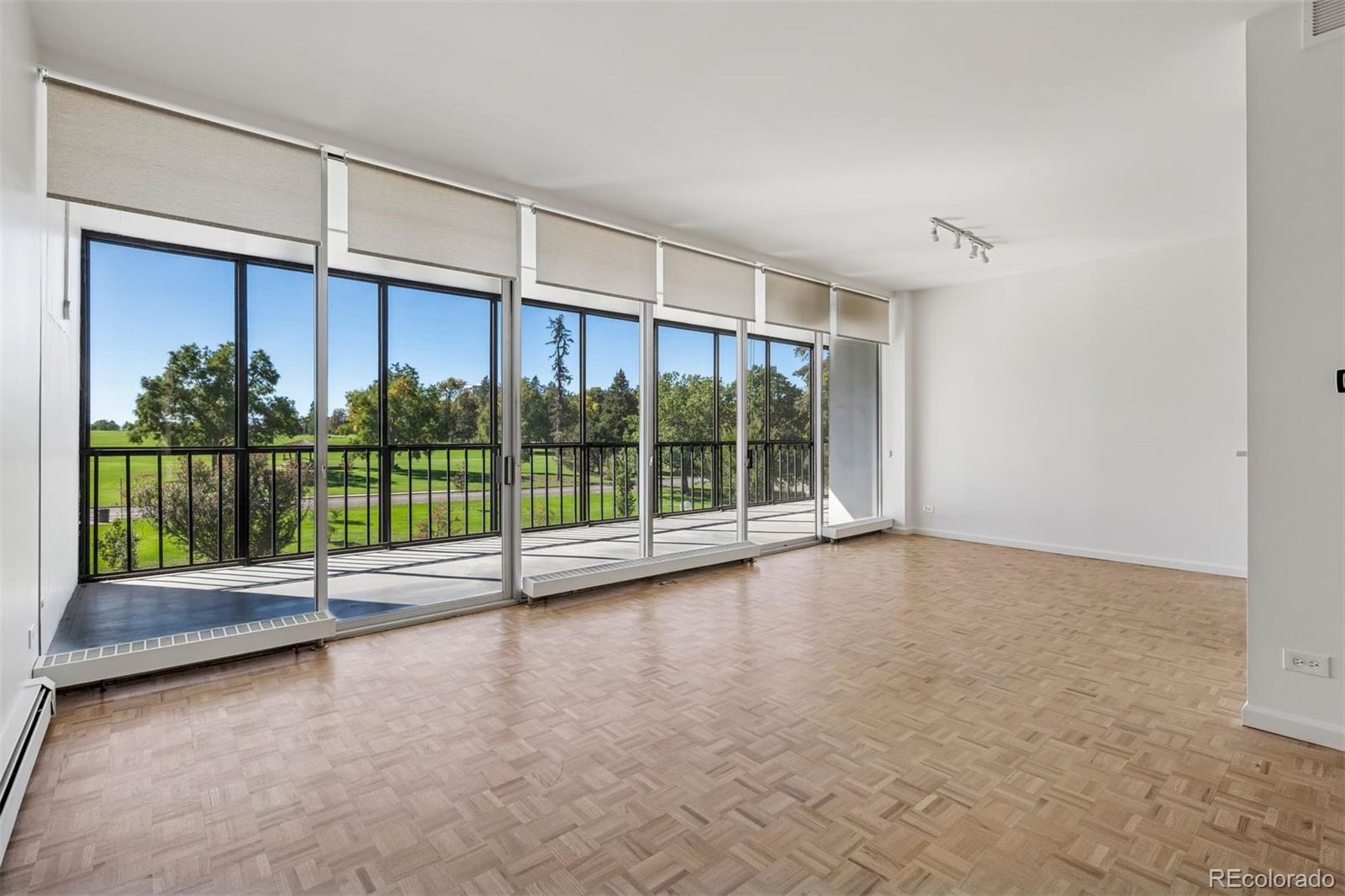 1201 North Williams Street, Unit 2A Denver, CO 80218 - Photo 2 of 29 a view of an empty room with a sliding door and balcony