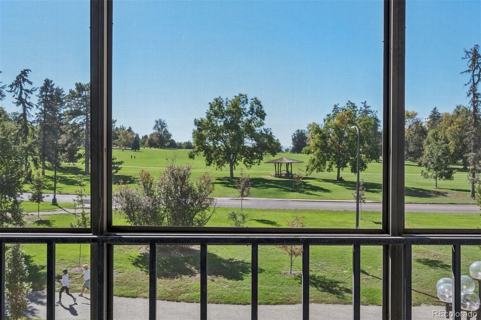 1201 North Williams Street, Unit 2A Denver, CO 80218 - Photo 5 of 29 a view of green trees from a window