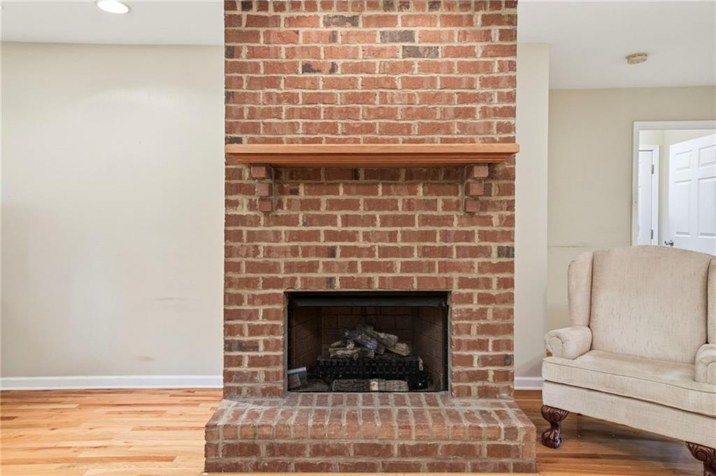 12 Whispering Pines Northeast Rome, GA 30161 - Photo 19 of 57 a living room with a fireplace