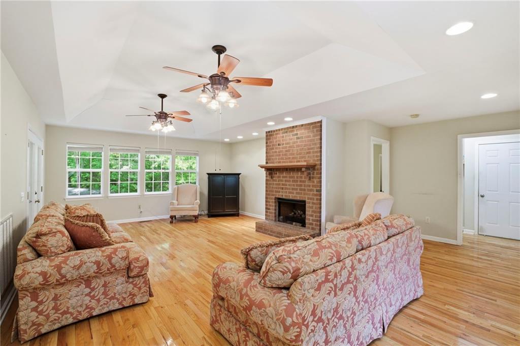12 Whispering Pines Northeast Rome, GA 30161 - Photo 30 of 57 a living room with furniture and a fireplace