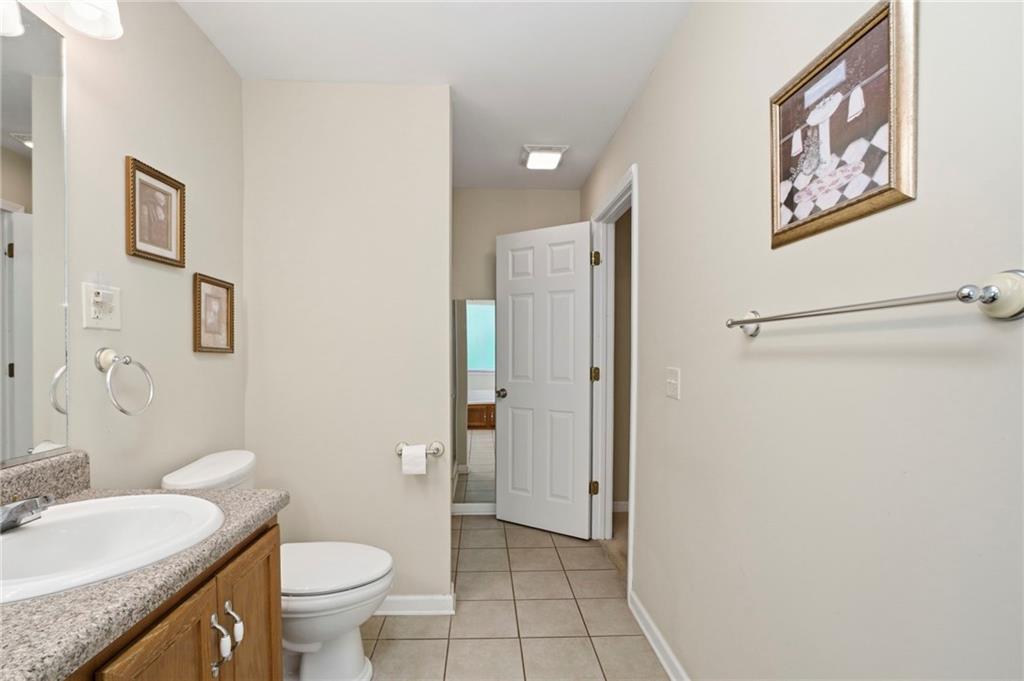 12 Whispering Pines Northeast Rome, GA 30161 - Photo 36 of 57 a bathroom with a granite countertop sink toilet and shower
