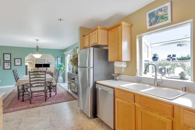a bathroom with mirror and window