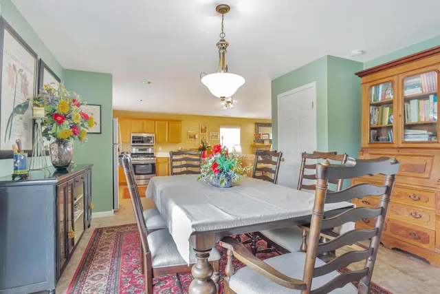 a view of a dining room with furniture window and outside view