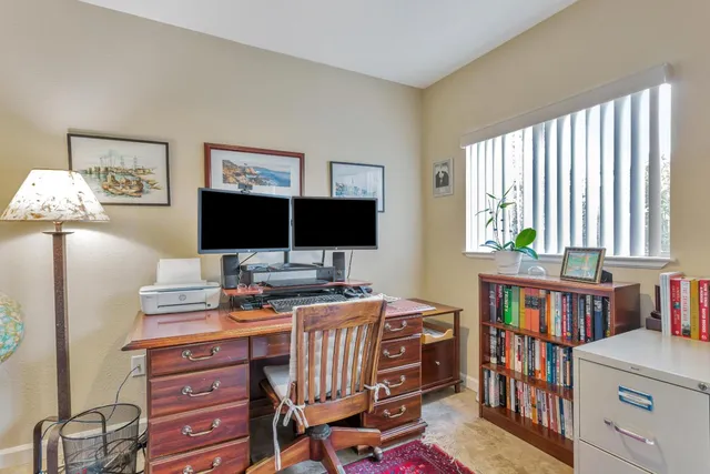 a bedroom with furniture and window