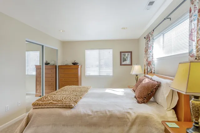 a bedroom with a bed and a cabinets