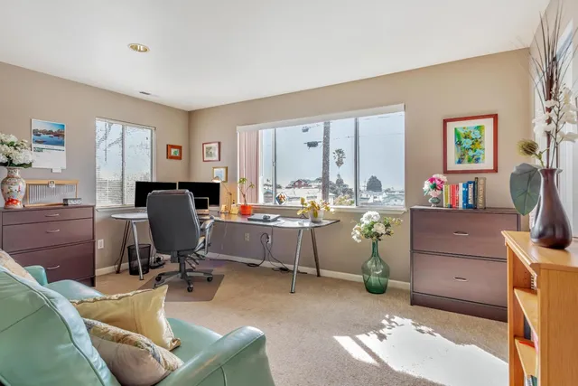 a view of a chairs and table in a backyard