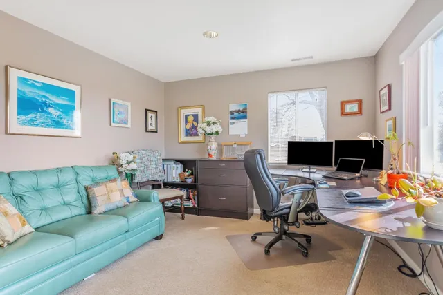 a view of a patio with couches table and chairs and potted plants