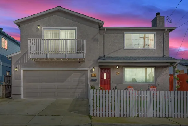 a front view of a house with a garage