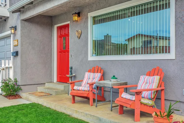 a backyard of a house with outdoor seating