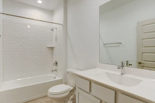 a bathroom with a sink a toilet and a bathtub