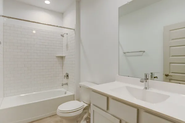 a bathroom with a sink a toilet and a bathtub