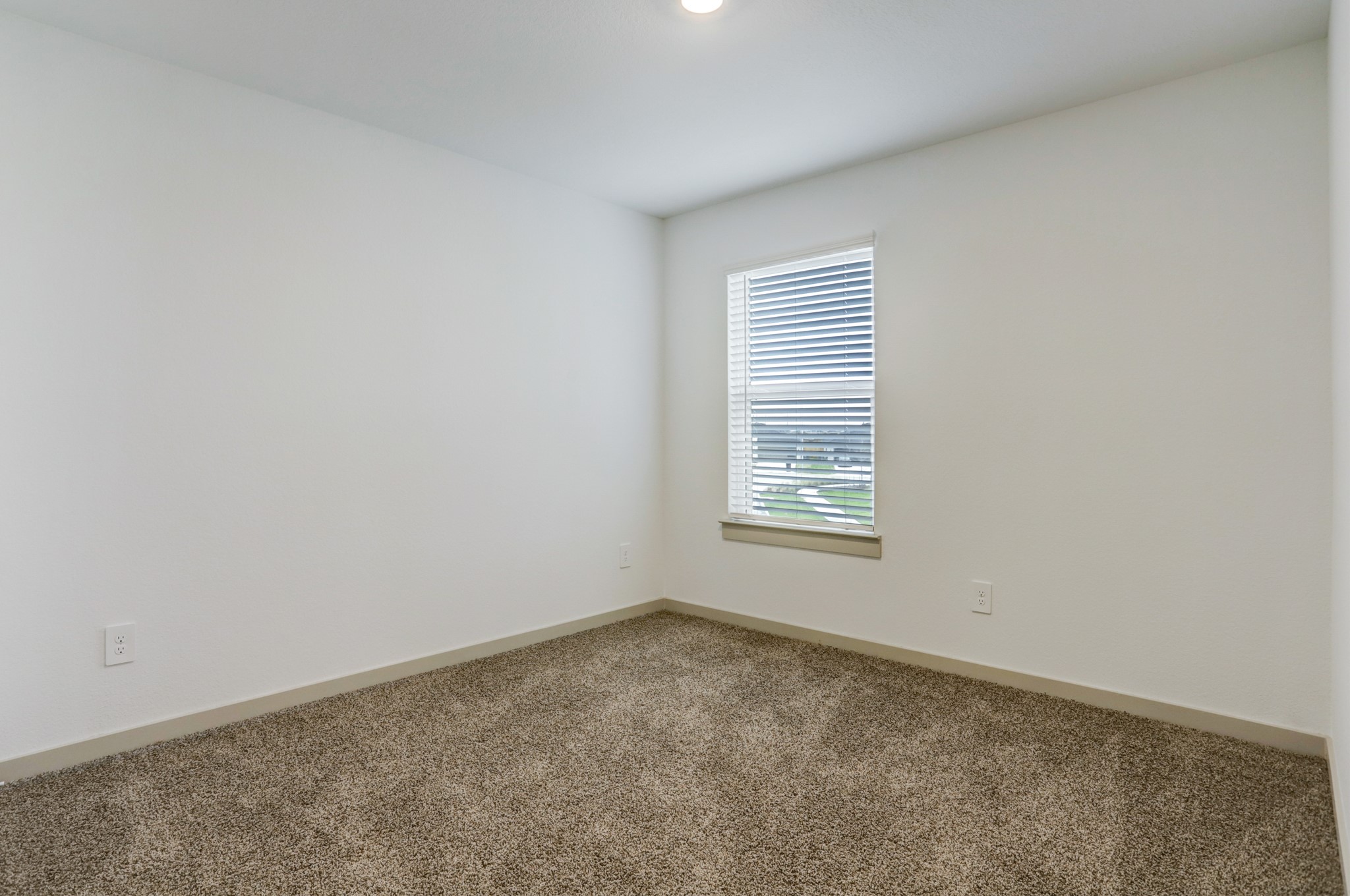 29866 Wildcat Way Katy, TX 77494 - Photo 19 of 25 an empty room with windows