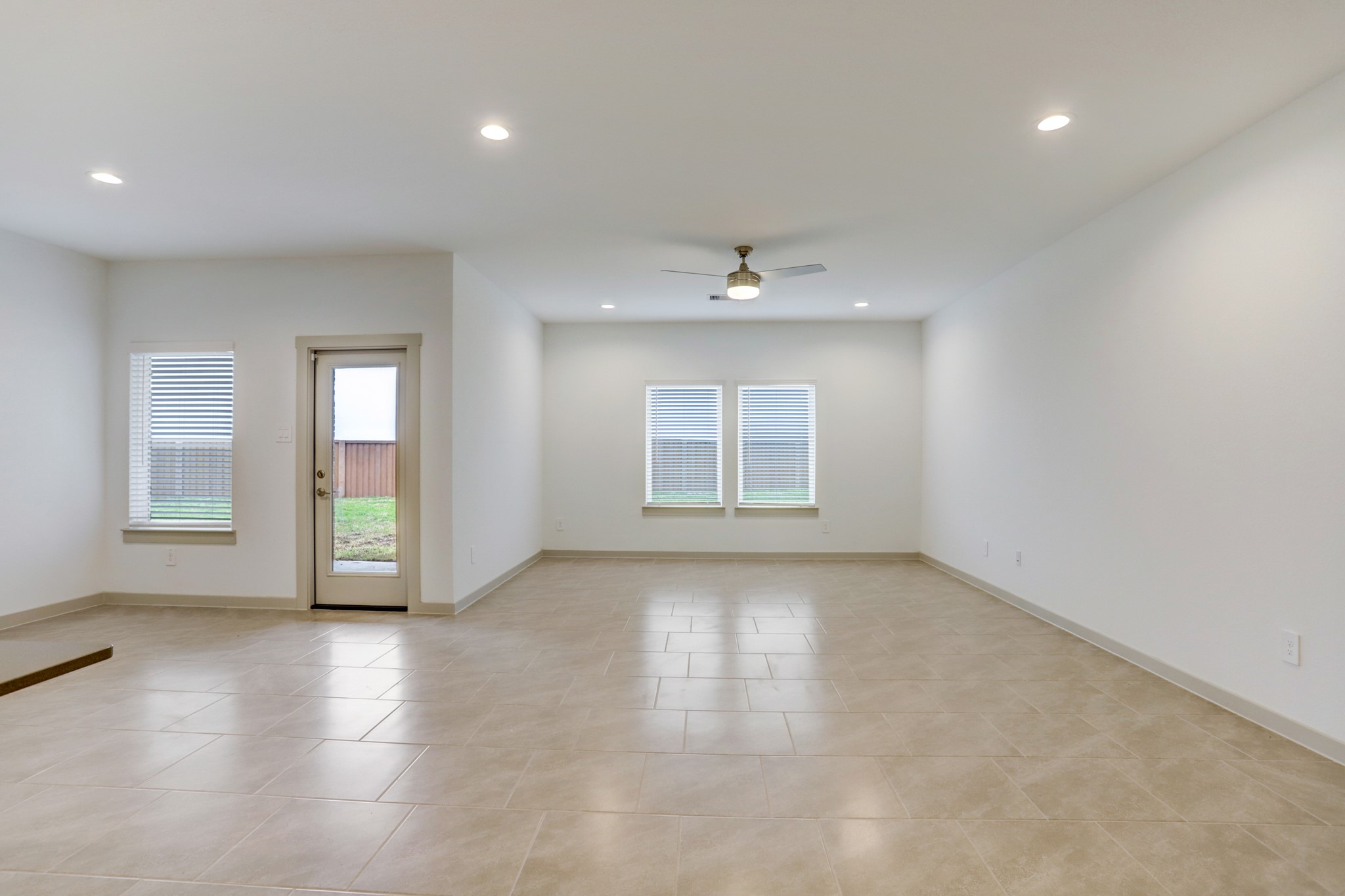 29866 Wildcat Way Katy, TX 77494 - Photo 4 of 25 an empty room with windows and entrance