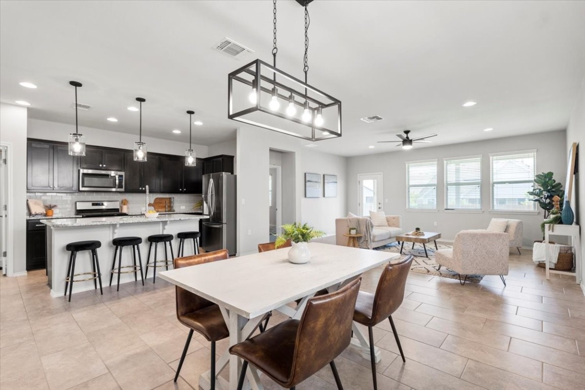 a view of a dining area with furniture window and wooden floor