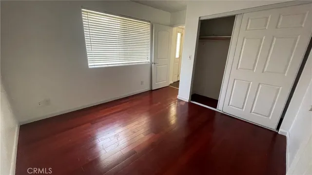 an empty room with wooden floor