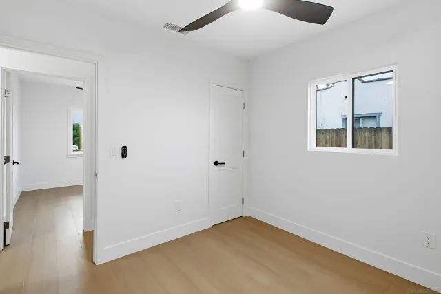 a bathroom with a granite countertop sink a toilet and a bathtub