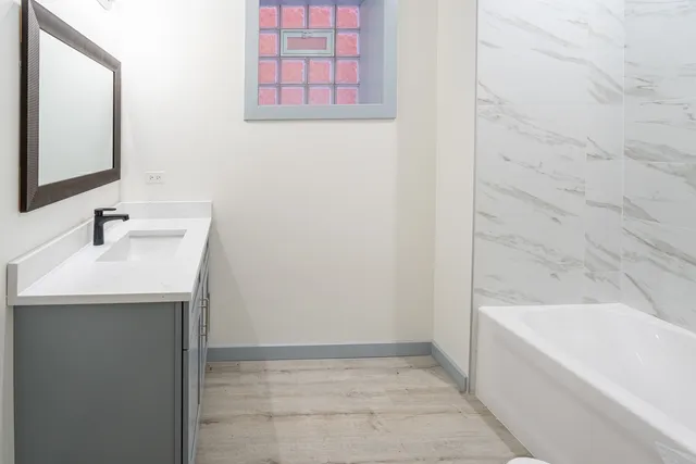 a bathroom with a sink and a bathtub