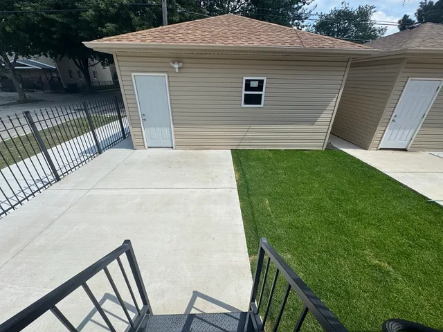 a view of a backyard with a garden