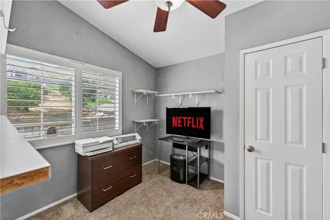 a room with furniture and a flat screen tv