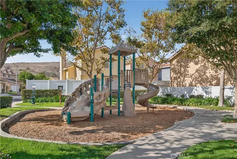 a view of a park with a slide