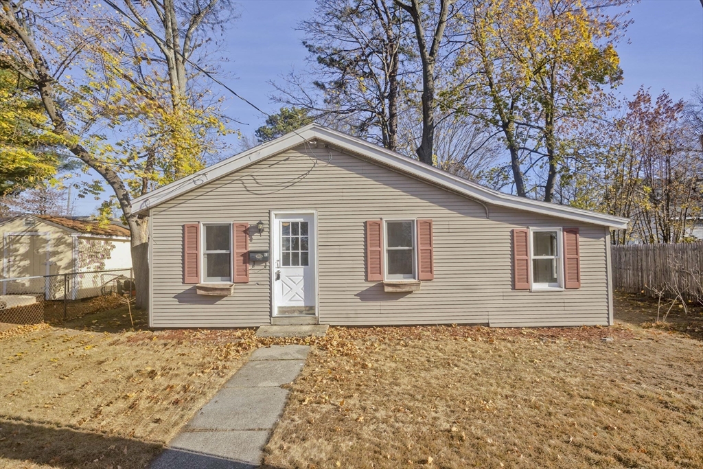 53 Champlain Street Springfield, MA 01151 - Photo 1 of 30 a front view of a house with a yard