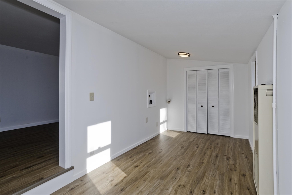53 Champlain Street Springfield, MA 01151 - Photo 18 of 30 a view of empty room with wooden floor