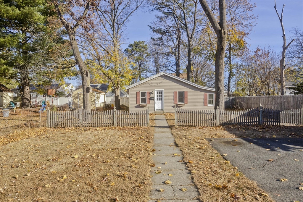 53 Champlain Street Springfield, MA 01151 - Photo 2 of 30 a front view of a house with a yard