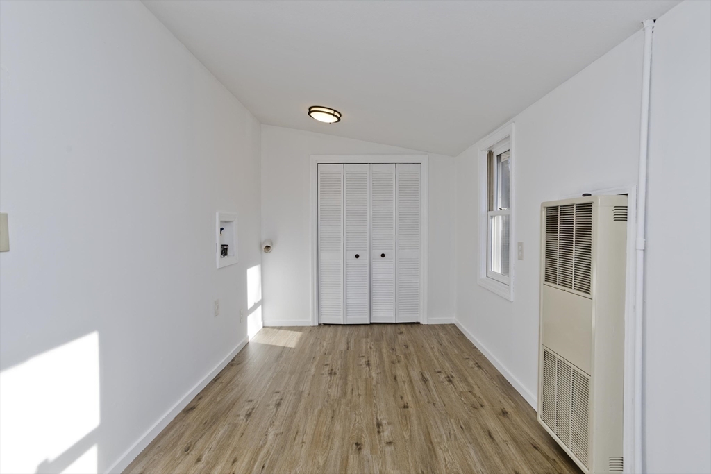 53 Champlain Street Springfield, MA 01151 - Photo 21 of 30 a view of a hallway with wooden floor