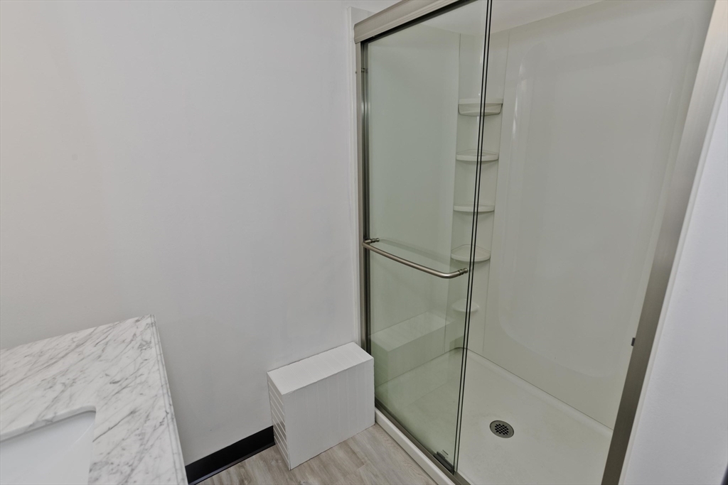 53 Champlain Street Springfield, MA 01151 - Photo 24 of 30 a bathroom with a shower and toilet