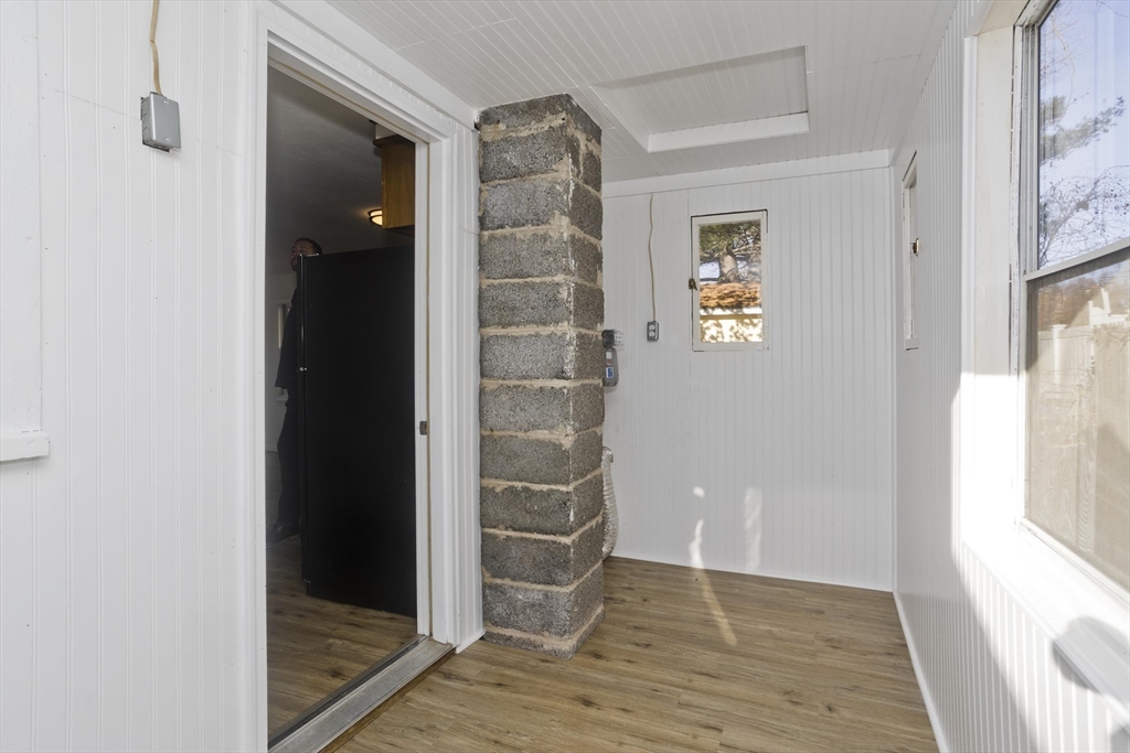 53 Champlain Street Springfield, MA 01151 - Photo 26 of 30 a view of an empty room with wooden floor and a window