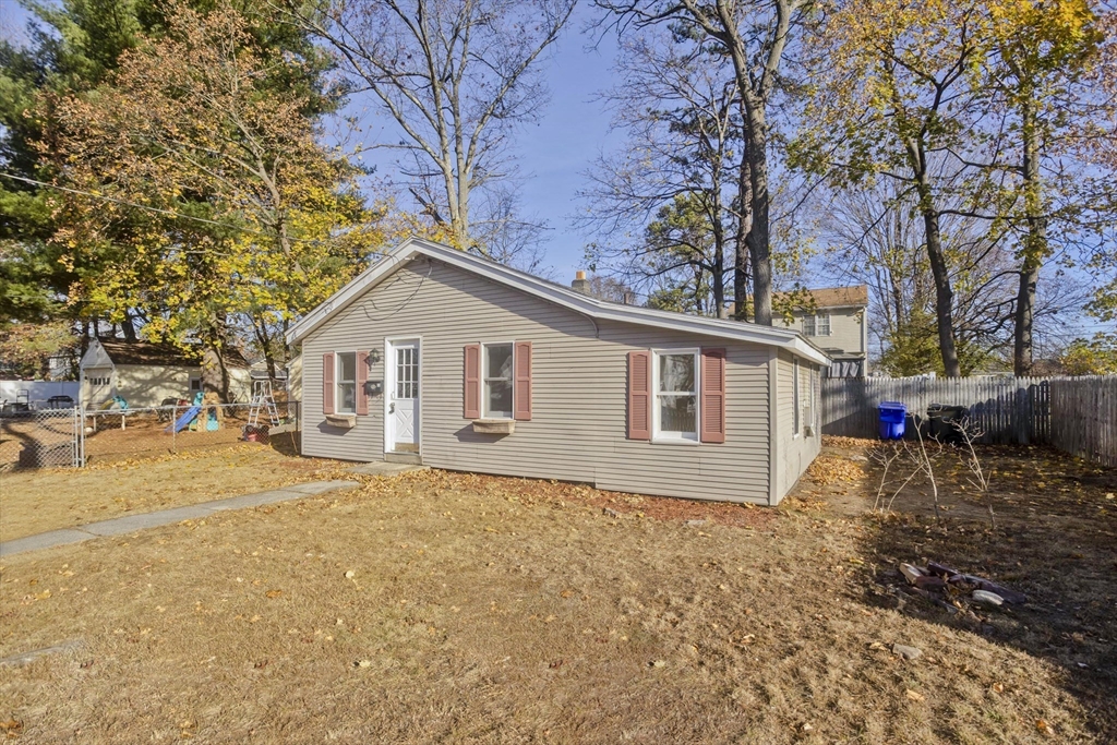53 Champlain Street Springfield, MA 01151 - Photo 3 of 30 a view of a house with a yard