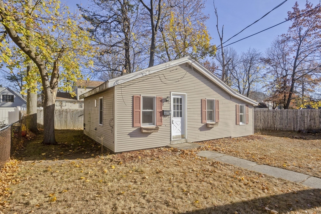 53 Champlain Street Springfield, MA 01151 - Photo 4 of 30 a front view of a house with a yard