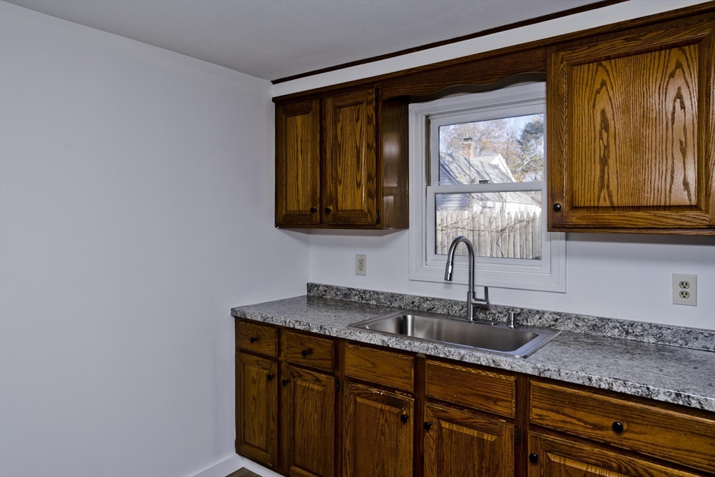 53 Champlain Street Springfield, MA 01151 - Photo 7 of 30 a bathroom with a sink and a mirror