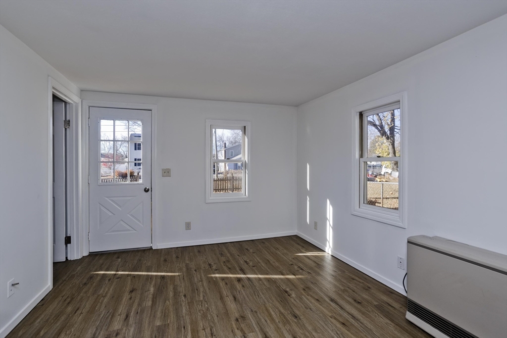 53 Champlain Street Springfield, MA 01151 - Photo 9 of 30 an empty room with windows and closet