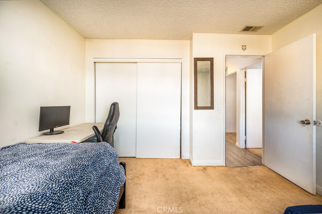 25899 Baylor Way Hemet, CA 92544 - Photo 18 of 29 a view of a workspace with furniture and a window