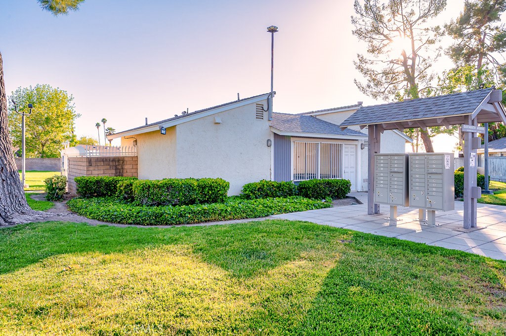 25899 Baylor Way Hemet, CA 92544 - Photo 25 of 29 a view of a house with a backyard and a tree