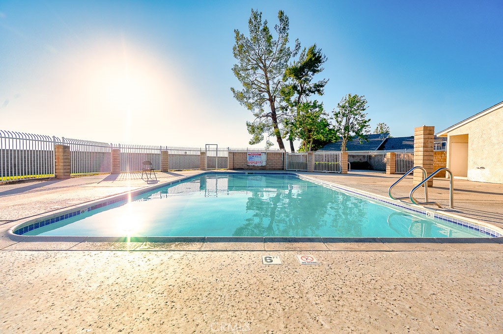 25899 Baylor Way Hemet, CA 92544 - Photo 26 of 29 a view of a swimming pool with an outdoor space