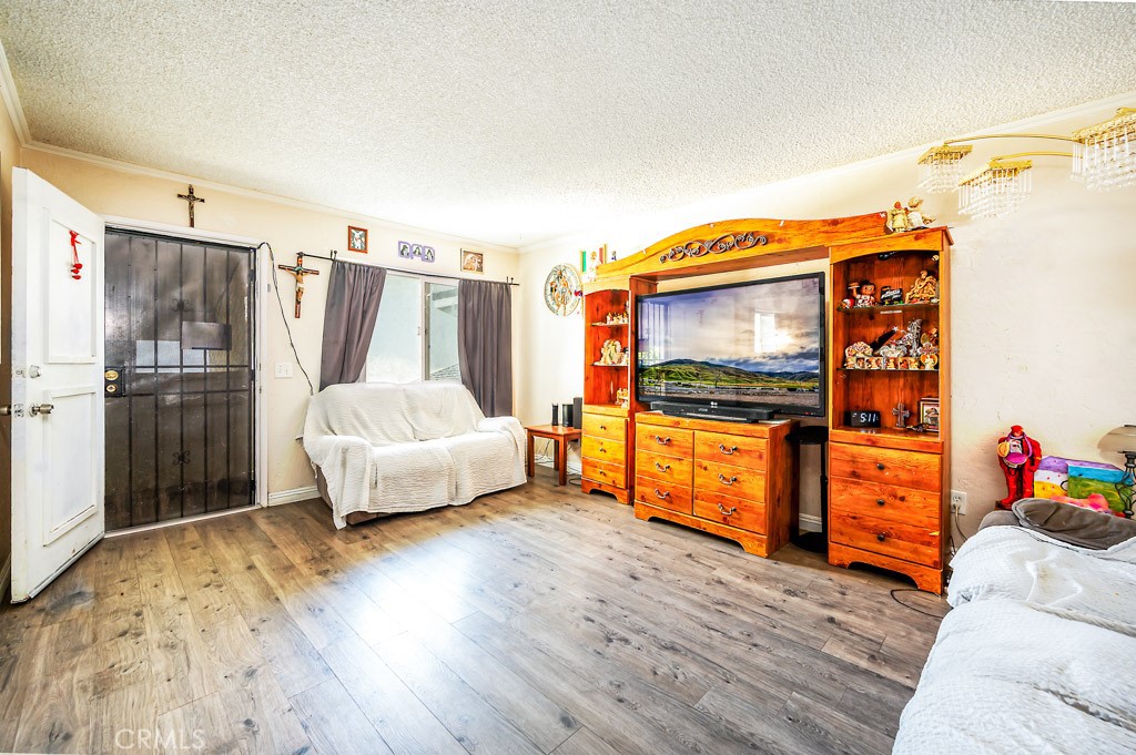 25899 Baylor Way Hemet, CA 92544 - Photo 3 of 29 a bedroom with a bed and a walk in closet