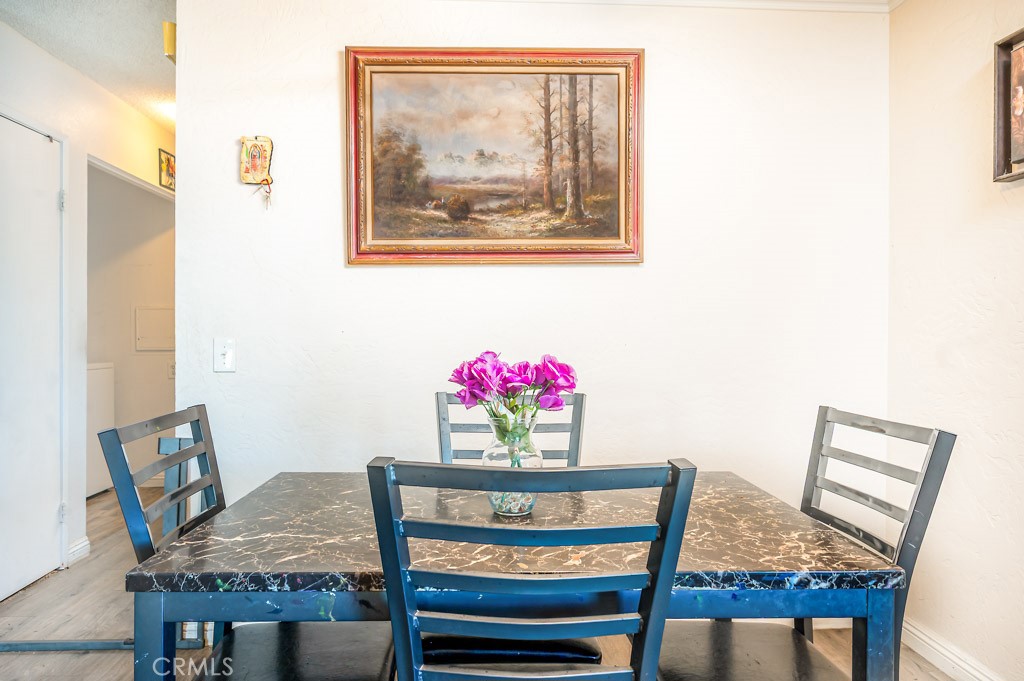 25899 Baylor Way Hemet, CA 92544 - Photo 6 of 29 a view of a dining room with furniture and wooden floor