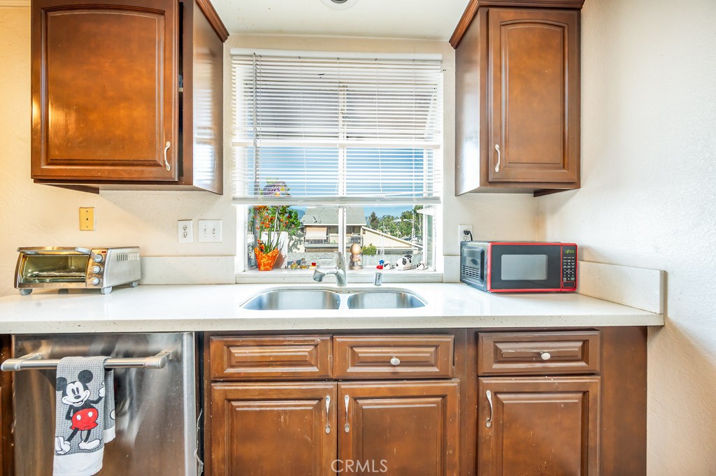 25899 Baylor Way Hemet, CA 92544 - Photo 7 of 29 a kitchen with a sink and a window