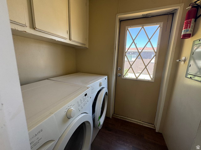 2491 Highway 89, Unit 315 Pleasant View, UT 84404 - Photo 18 of 34 Utility area featuring a glass-paned door with diamond grilles, wood-finish flooring, and upper cabinetry
