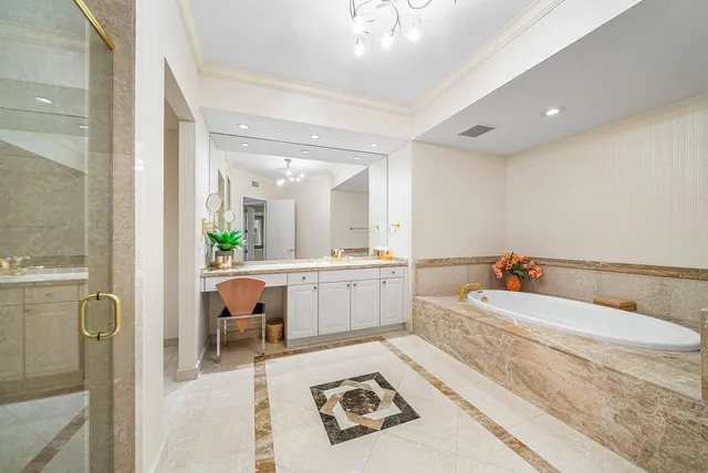 a spacious bathroom with a shower sink and mirror