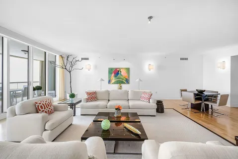 a living room with furniture or couch and a large window