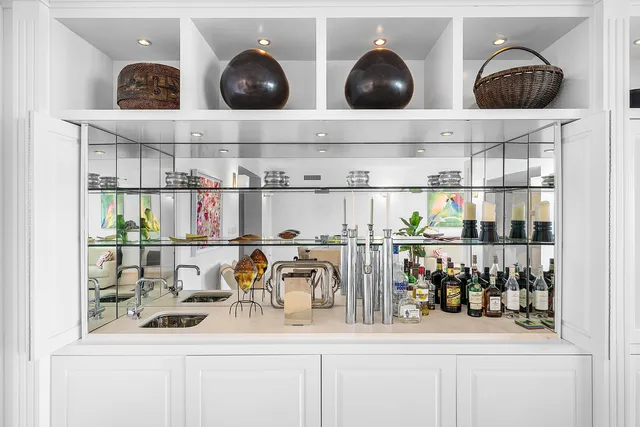 a living room with lots of furniture and a table