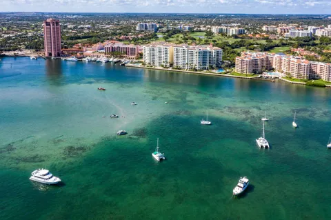 a living room with fireplace furniture and a chandelier