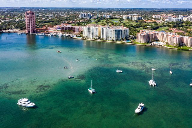 a living room with fireplace furniture and a chandelier