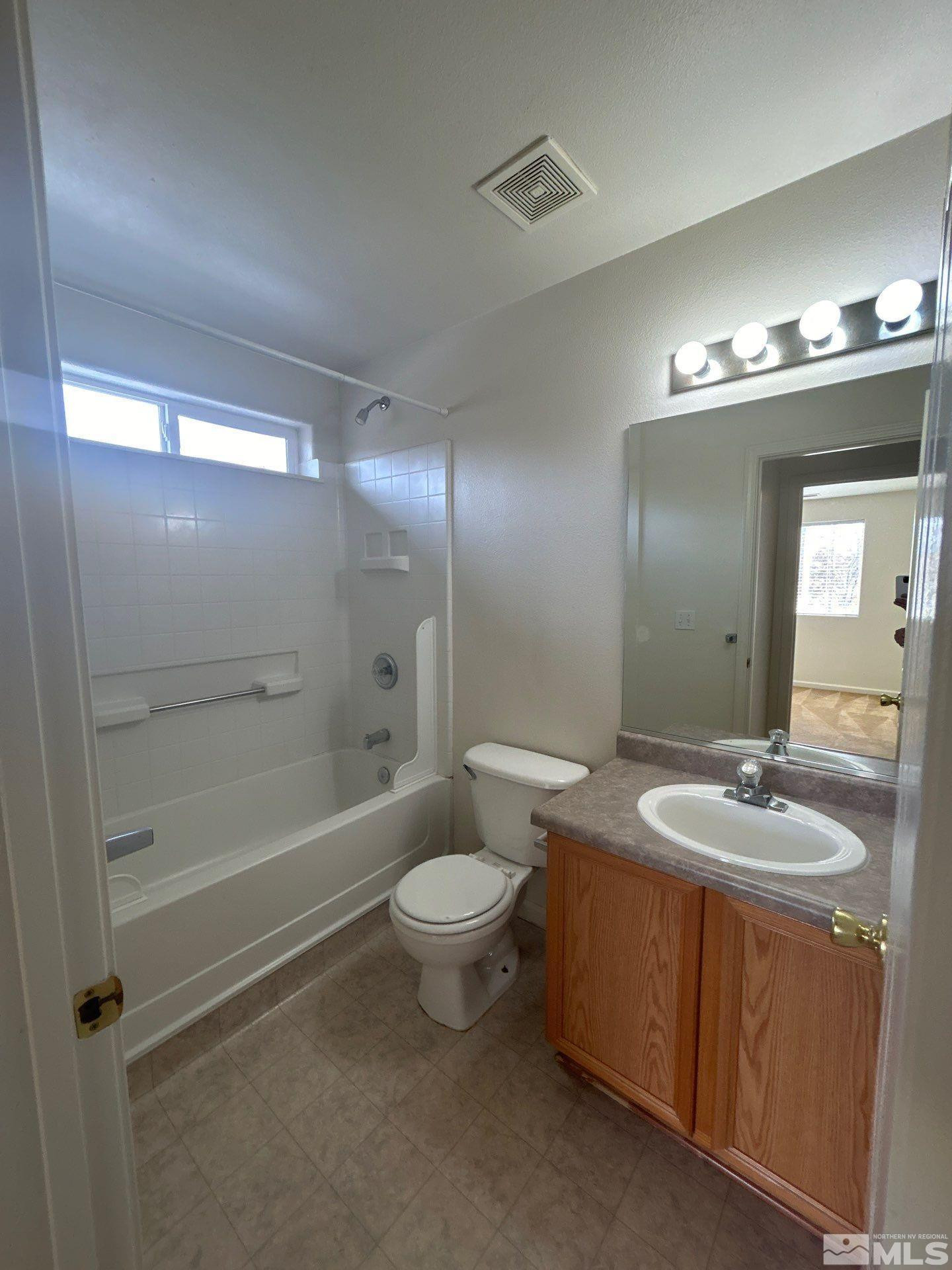 405 Holcomb Avenue Reno, NV 89502 - Photo 12 of 17 a bathroom with a sink a toilet and shower