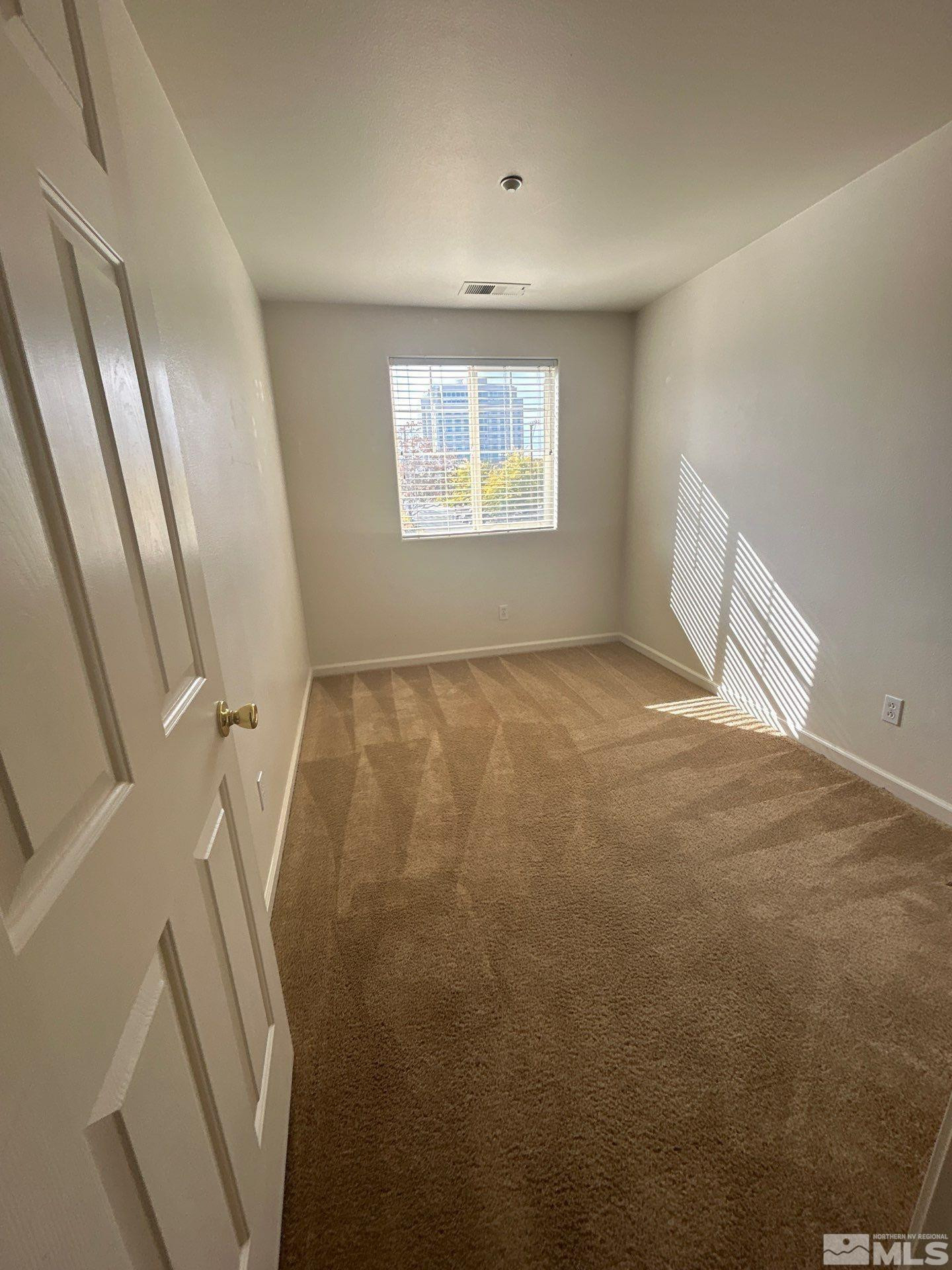 405 Holcomb Avenue Reno, NV 89502 - Photo 13 of 17 a view of an empty room with a window