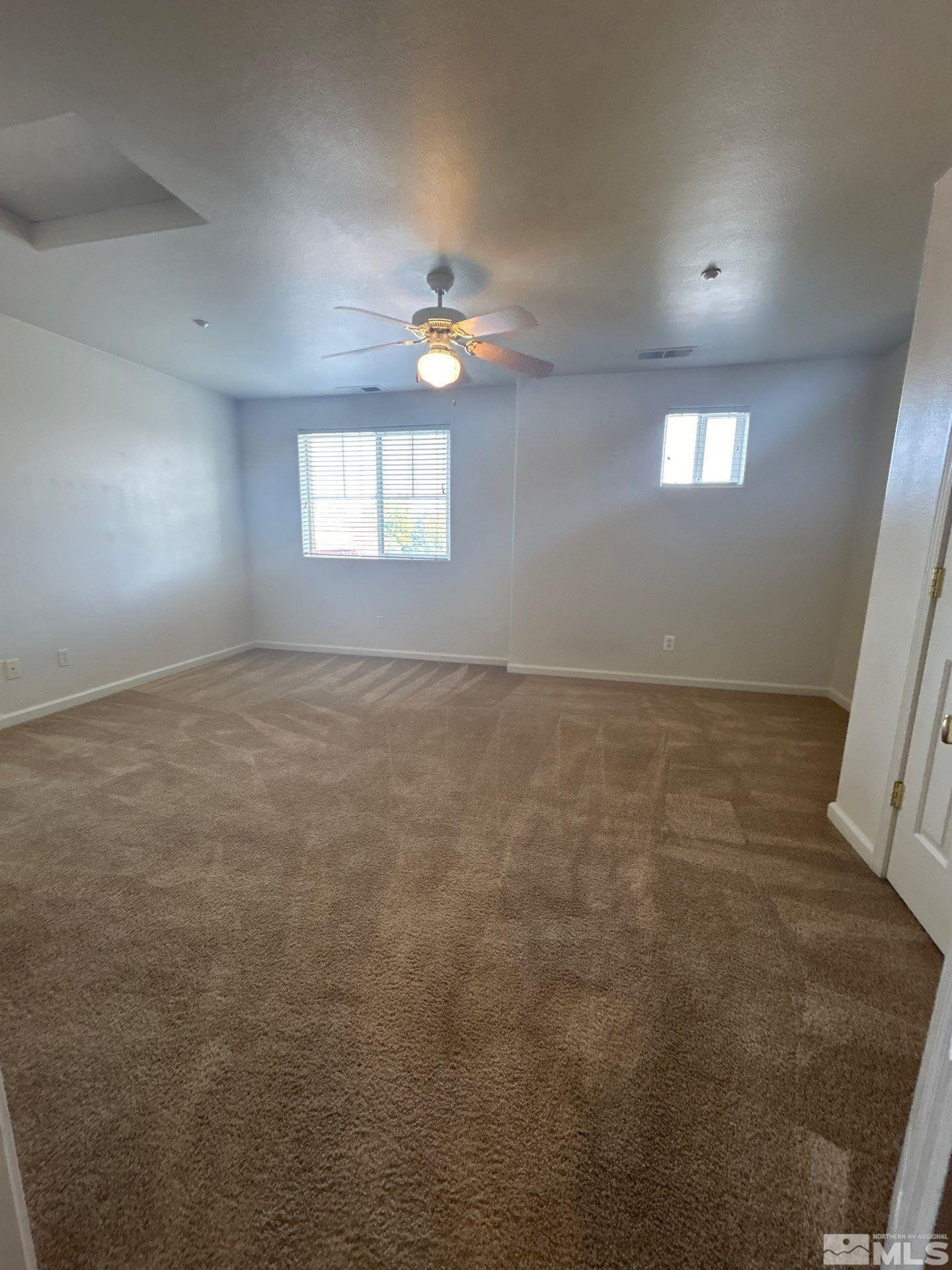 405 Holcomb Avenue Reno, NV 89502 - Photo 16 of 17 an empty room with windows and closet