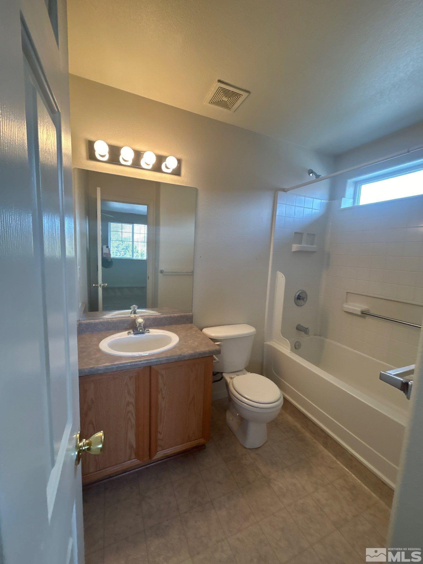 405 Holcomb Avenue Reno, NV 89502 - Photo 17 of 17 a bathroom with a sink toilet and shower